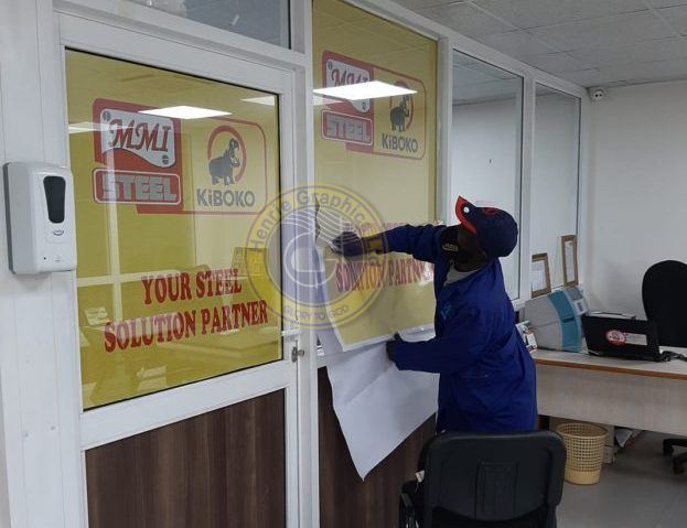 A man branding an office